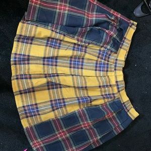 A 2x pleated green, blue, red, yellow skirt worn literally once.